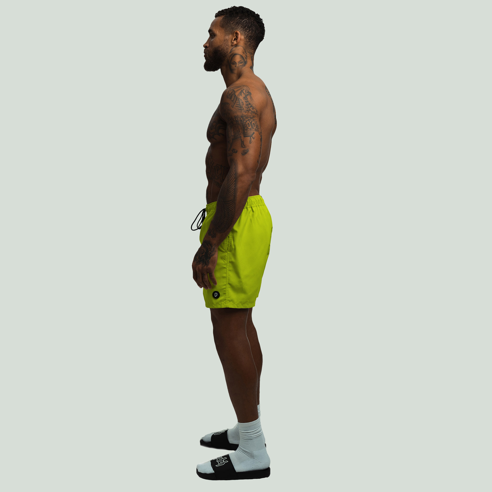 SideView of the Volt Color Patch Resort Shorts worn by a Model